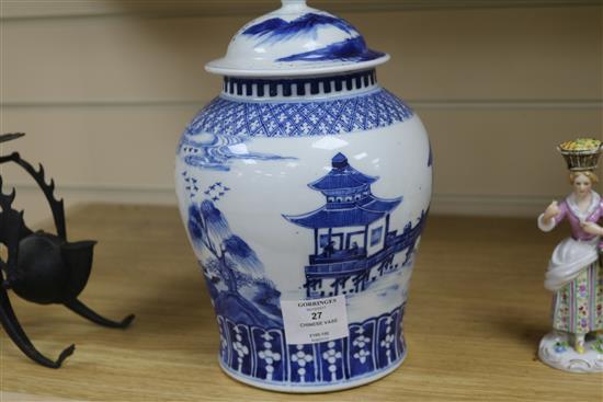 A late 19th century Chinese blue and white lidded baluster vase